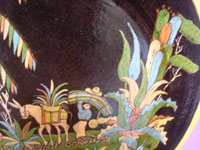 Mexican vintage pottery and ceramics, a stunningly beautiful black-ware charger with wonderful and very crisp artwork decorating the front, Tonala or San Pedro Tlaquepaque, c. 1930's. Closeup photo of the Mexican farmer and his burro.