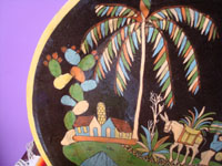 Mexican vintage pottery and ceramics, a stunningly beautiful black-ware charger with wonderful and very crisp artwork decorating the front, Tonala or San Pedro Tlaquepaque, c. 1930's. Closeup photo of the house under a lovely cactus and large palm tree.