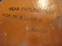 Photo of the bottom of the skillet showing Balbino Lucano's signature.