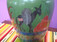 Mexican vintage pottery and ceramics, a lovely pottery vase with a wonderful green background and beautiful artwork, Tonala or San Pedro Tlaquepaque, c. 1930's. Closeup photo of the lower part of the vase showing a wonderful Mexican burro.