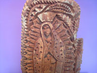 Mexican vintage devotional art and folk art, a wonderful Tarahumara carving of Our Lady of Guadalupe, northern Mexico, c. 1980's.  Closeup photo of the top of the carving showing Our Lady's face.