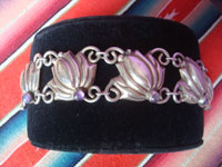Mexican vintage sterling silver jewelry, and Taxco vintage sterling silver jewelry, a beautiful sterling silver bracelet with floral pendants and cabochons of amethyst, Taxco, c. 1940.  Another side view of the bracelet.