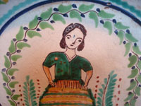 Mexican pottery and ceramics, a wonderful pottery plate by the famous Gorky Gonzalez, Guanajuato, c. 1950's. Closeup photo of the lovely woman at the center of the plate.