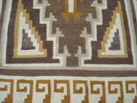 Native American Indian textiles, and Navajo vintage textiles, a beautiful Navajo Klagetoh rug with all natural colored yarn, Arizona, c. 1950's.  Closeup photo of one end of the textile, showing the very tight weave.