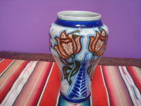 Mexican vintage pottery and ceramics, a beautiful Talavera vase with beautiful floral decorations and wonderful blue glazes, marked with the Uriarte mark on the bottom, Puebla, c. 1940's.  Main photo of the Talavera vase.