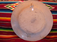 Mexican vintage pottery and ceramics, a charger decorated in art-deco style with a very lovely exotic bird, Tlaquepaque, Jalisco, c. 1950's. Photo of the back side of charger.