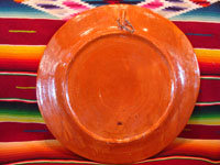 Mexican vintage pottery and ceramics, a lovely charger with a terra-cotta background and two fantasia-style birds, Tlaquepaque, Jalisco, c. 1940's. Photo of the back side of the charger.