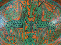 Mexican vintage pottery and ceramics, a very lovely fantasia (fantasia-ware) oval charger with very intricate and imaginative decorations, Tonala or Tlaquepaque, Jalisco, c. 1940. Closeup photo of the imaginative animals in the center of the charger.