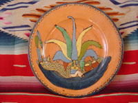 Mexican vintage pottery and ceramics, a beautiful pottery plate with a very finely painted scene of a Mexican campesino resting under his favorite maguey cactus, Tonala or Tlaquepaque, Jalisco, c. 1940's. Main photo.