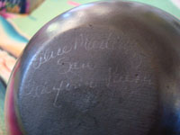 Native American Indian pottery and ceramics, a beautiful blackware jar with lid, signed Alice Martinez, San Ildefonso Pueblo, New Mexico, c. 1980's. Photo of the bottom of the jar showing the artist's signature.