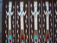 Native American Indian textiles, and Navajo textiles and rugs, a wonderful Yei-pattern textile or rug with beautiful Yei figures, Navajo, Arizona or New Mexico, c. 1970. Closeup view of a part of the Navajo Yei rug.