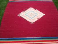 Mexican vintage textiles, and Mexican vintage Saltillo serapes (sarapes), a lovely textile with a beautiful color-combination and woven of fine wool, Tlaxcala, c. 1940's.  Closeup photo of the center medallion.