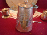 Mexican vintage copper and silver jewelry, an elegant and beautiful tea/coffee set of copper with sterling silver decorative scenes on each piece, signed Victoria, Taxco, c. 1940's. Closeup photo of the tea or coffee pot.