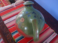 Mexican vintage pottery and ceramics, a beautiful burnished pottery water pitcher with a wonderful avocado-green background and fine, precise artwork, Tonala or San Pedro Tlaquepaque, c. 1930.  A photo shot from behind the pitcher.