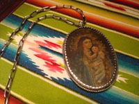 Mexican vintage devotional art, and Mexican vintage sterling silver jewelry, a beautiful relicario with the small retablo beautifully painted on tin, with a lovely hand-made silver chain, c. 1920's. Closeup photo of the second side.
