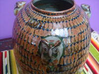 Mexican vintage pottery and ceramics, a beautiful pottery or ceramic jar with incredible metallic glazing of copper, deep blue, and burgundy, signed on the bottom by the famous artist, Jorge Wilmot, Tonala or San Pedro Tlaquepaque, c. 1970's. Closeup photo of part of the jar.