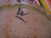 Mexican vintage pottery and ceramics, a beautiful pottery or ceramic jar with incredible metallic glazing of copper, deep blue, and burgundy, signed on the bottom by the famous artist, Jorge Wilmot, Tonala or San Pedro Tlaquepaque, c. 1970's. Photo of the bottom of the jar with Wilmott's signature.