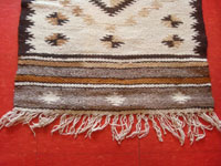 Mexican vintage textiles and serapes, a beautiful Mayo textile with wonderful natural wool colors, Northern Mexico and the border with Arizona, c. 1940's. Closeup photo of one edge of the textile showing the fringe.