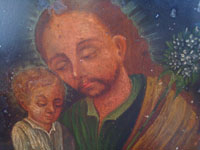 Mexican vintage devotional art, a retablo painted on tin depicting St. Joseph with the baby Jesus, c. 1920.  Main photo of the retablo.