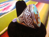 Native American vintage sterling silver jewelry, and Navajo sterling silver jewelry, a beautiful silver ring with a very fine turquoise stone (very possibly Kingman) and wonderful stamping on each side, very possibly a Fred Harvey piece, Arizona, c. 1940. Side view of the ring showing the fine stamping.