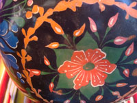 Mexican vintage folk art, a wonderful laquerware gourd with beautiful floral designs, Uruapan, Michoacan, c. 1930's.  Closeup photo of part of the gourd showing the floral decorations.