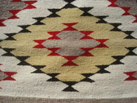 Native American Indian textiles, and Navajo vintage rugs and textiles, a beautiful Navajo eye-dazzler, Arizona or New Mexico, c. 1950's.  Closeup photo of a part of the textile showing the fine weave.