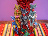 Mexican vintage folk art, and Mexican vintage pottery and ceramics, a beautiful pottery sculpture of a burning tower of devils delighted by the tasty fowl being roasted in a bowl on the top, Ocumicho, Michoacan, c. 1950. Another full view of the sculpture.