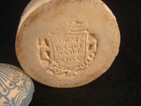 Mexican vintage pottery and ceramics, a jar with lid, signed Arias, with floral decorations, c. 1930-40. Beautiful cream colored glaze with blue floral decorations. A photo of the Arias stamp on the bottom of jar.