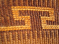 Native American Indian basket, a Northwest Coast twined purse, Tsimshian, c. 1900-10. Beautifully woven of cedar bark with geometric imbricated decoration and woven cedar bark handles. A second closeup.