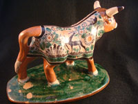 Mexican vintage pottery and ceramics, and Mexican vintage folk art, a pottery bull with fine hand-painted decoration, c. 1950. Signed on the bottom, Jose Trinidad Bernabe Lopez, Tonala, Jalisco Mexico.
