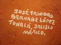 Mexican vintage pottery and ceramics, and Mexican vintage folk art, a pottery bull with fine hand-painted decoration, c. 1950. Signed on the bottom, Jose Trinidad Bernabe Lopez, Tonala, Jalisco Mexico. Signature on bottom.