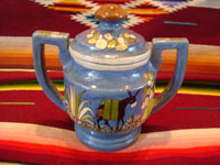 Mexican vintage pottery and ceramics, a lovely lidded jar with a blue background and exquisite artwork, Tlaquepaque, Jalisco, c. 1930. The jar is stamped on the bottom with the mark of the famous Arias shop in Tlaquepaque. Main photo of lidded jar.