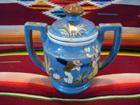 Mexican vintage pottery and ceramics, a lovely lidded jar with a blue background and exquisite artwork, Tlaquepaque, Jalisco, c. 1930. The jar is stamped on the bottom with the mark of the famous Arias shop in Tlaquepaque. Photo showing the second side of the jar.