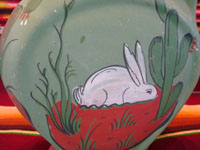 Mexican vintage pottery and ceramics, a beautiful flatware (opaco) water pitcher with a wonderful bunny and floral designs, Tonala, Jalisco, c. 1930's. Closeup photo of the bunny on one side of the pitcher.