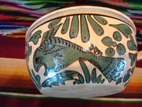 Mexican vintage pottery and ceramics, a fantasia-style lidded dish with fanciful dragon and fish, Tlaquepaque, Jalisco, c. 1930-40. Photo showing one of the fish decorating a side of the bowl.