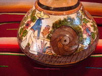 Mexican vintage pottery and ceramics, a water jar attributed to the great Balbino Lucano, Tlaquepaque, Jalisco, c. 1920-30's. The jar is done in the petatillo hatchwork style (with straw-like hatchwork in the background) for which Balbino Lucano is famous. Photo of the scene of a Mexican campersino on the second side of the Tlaquepaque pottery jar.