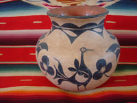 Native American Indian antique pottery, a beautiful pottery olla or vase, Santo Domingo Pueblo, c. 1900. The artwork on this olla is incredibly beautiful, with a wonderful bird and beautiful floral decorations.  Main photo.