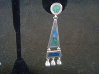 Mexican vintage sterling silver jewelry, and Taxco vintage sterling silver jewelry, a lovely pair of dangling earrings with silver and jade, Taxco, c. 1940's. Closeup photo of one earring.