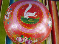 Mexican vintage folk art, a beautifully decorated "jicara" (gourd) used for drinking champurrada or horchata (two popular beverages made of milk, rice, and cinnamon), Puebla, c. 1950. Photo of the outside of the gourd showing the squirrel.