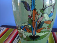 Mexican vintage pottery and ceramics, a lovely pottery vase with a beautiful green background and very fine and crisp artwork, Tonala or San Pedro Tlaquepaque, c. 1930's. Closeup photo of the artwork near the base.