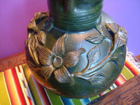 Mexican vintage pottery and ceramics, a beautiful pottery pitcher decorated with wonderful floral relief-work, Oaxaca, c. 1950's. Closeup photo of the pitcher showing the foral designs.
