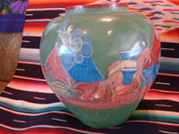 Mexican vintage pottery and ceramics, a beautiful burnished, green pottery olla with incredibly wonderful scenes, Tonala, Jalisco, c. 1930's. The scenes feature a campesino and his burro.