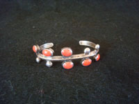 Native American Indian vintage silver jewelry, and Navajo vintage silver jewelry, a beautiful silver and coral bracelet, Navajo, c. 1930's. Main photo of the Navajo silver bracelet with coral.