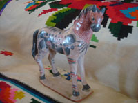 Mexican vintage folk art, and Mexican vintage pottery and ceramics, a lovely burnished pottery horse with beautiful hand-painted decorations, Tonala, c. 1950's. A view of the second side of the pottey horse.
