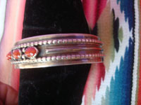 Native American Indian vintage sterling silver jewelry, and Navajo sterling silver jewelry, a beautiful silver bracelet with lovely decorations of fine coral, Arizona or New Mexico, c. 1950's. Closeup photo from the side of the bracelet showing the band.