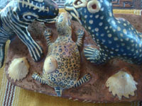 Mexican vintage folk art, a fanciful and wonderful pottery sculpture of two dueling seals and a startled turtle, Ocumicho, Michoacan, c. 1940's. Photo of the other side of the sculpture showing the seashells.