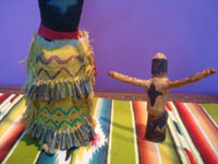 Native American Indian folk art, a pair of Apache Crown or Gaan dancers with outstretched arms, Arizona, c. 1940's. Closeup photo of the smaller dancer.