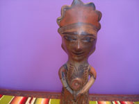Mexican vintage folk art, a pottery statue of a shaman, possibly used for ceremonial purposes, Guerrero, c. 1940's. Closeup photo of the face.