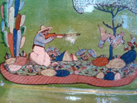 Mexican vintage pottery and ceramics, a beautiful rectangular pottery dish decorated with a finely painted hunting scene, Tonala or San Pedro Tlaquepaque, c. 1940. Closeup photo of the hunter.