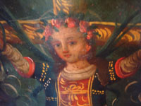 Mexican vintage devotional art, a retablo painted on tin depicting Santa Liberata on a cross, Mexico, c. 1940's. Closeup photo of the saint's face.